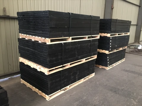 Finished rubber expansion joints placed on a wooden rack