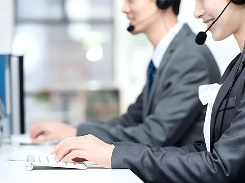 Two staff members are handling after-sales issues
